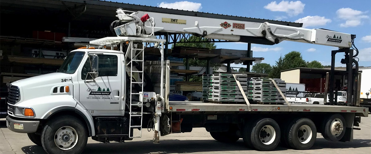 our delivery boom truck with a couple pallets of building materials on the bed