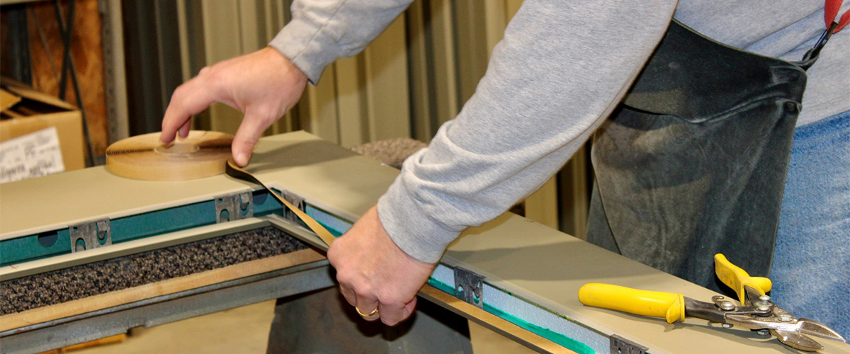 worker measuring a frame