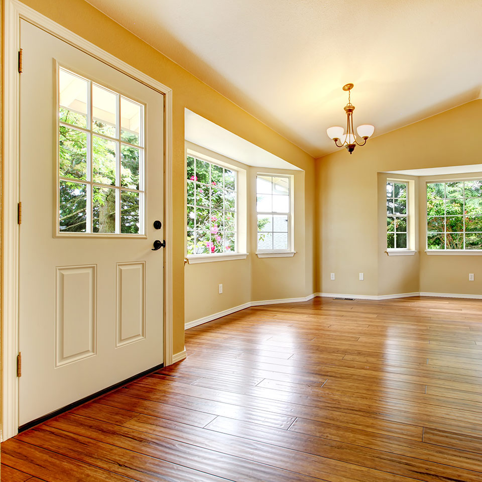 a room with a door and some windows