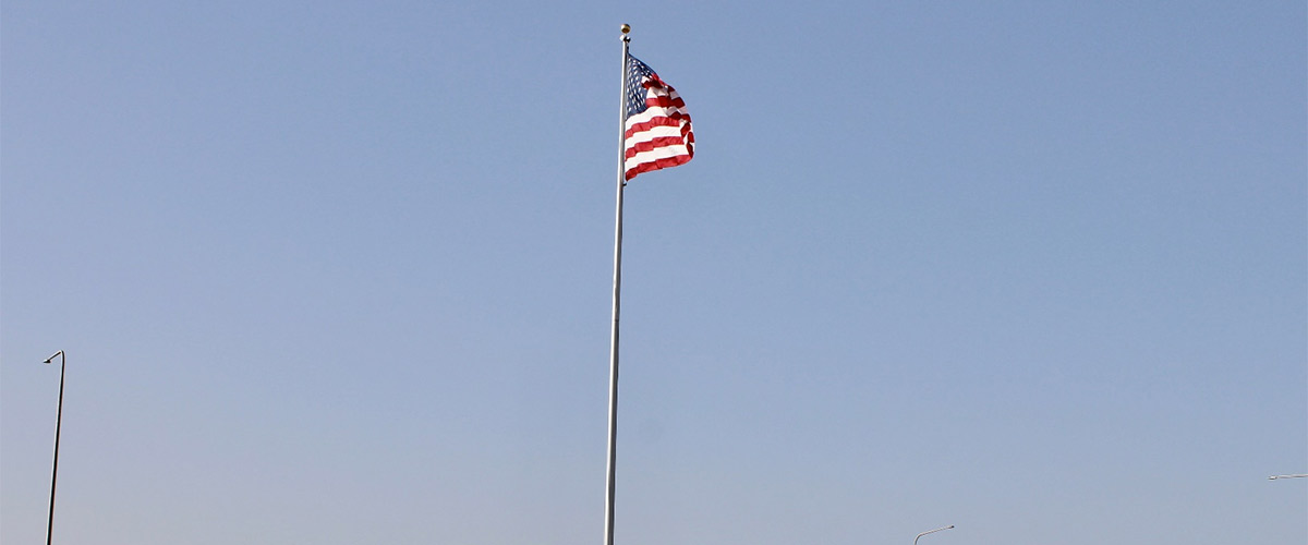 United States flag atop a flag pole